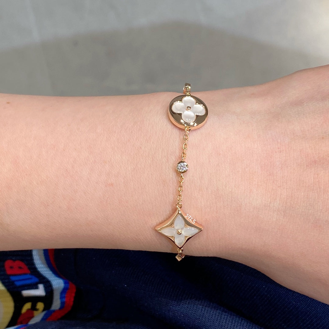 [Regal Gem]STAR AND SUN 4 MOTIF WHITE MOP PINK GOLD BRACELET