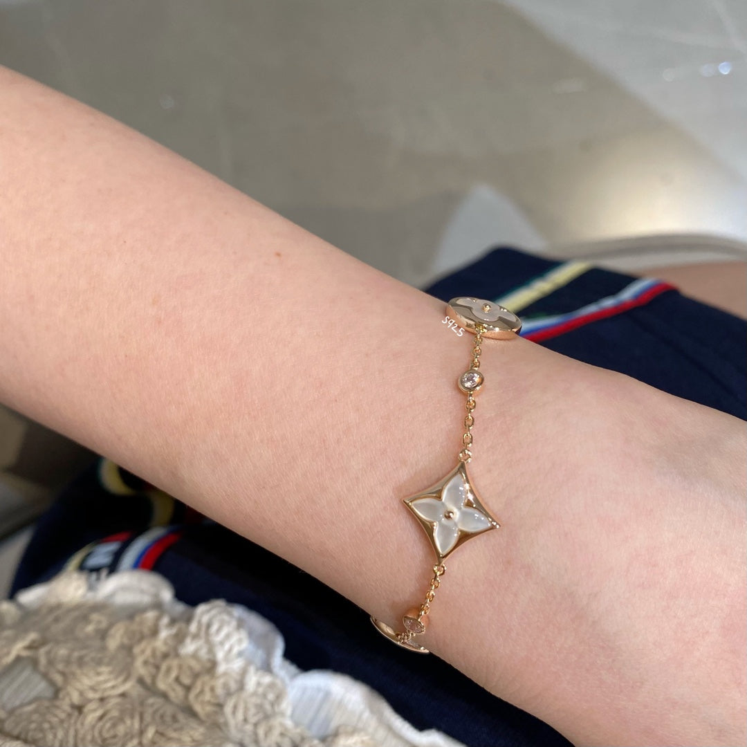 [Regal Gem]STAR AND SUN 4 MOTIF WHITE MOP PINK GOLD BRACELET